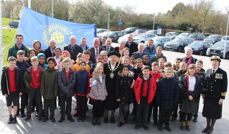 Children from Greythorn Primary School join the Mayor of Rushcliffe to raise the Commonwealth flag