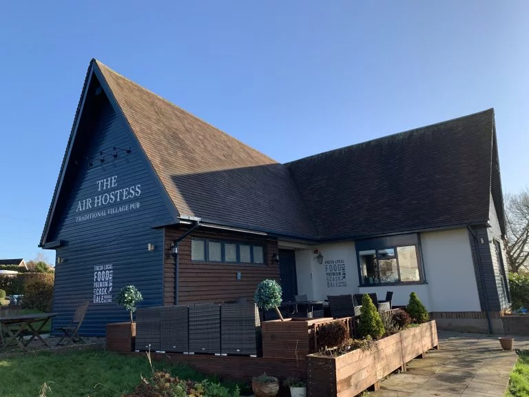 Villagers celebrate after completing purchase of community pub