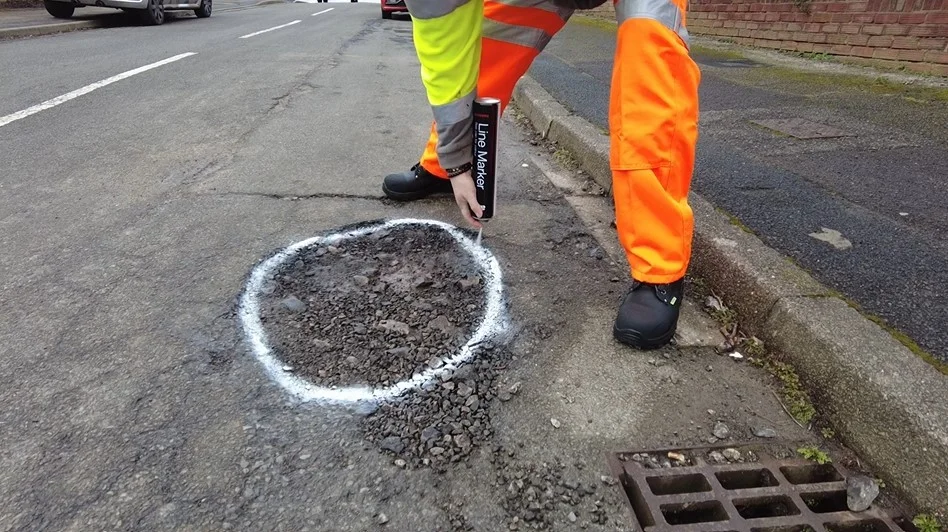 A Via East Midlands inspector identifying a pothole in Arnold.