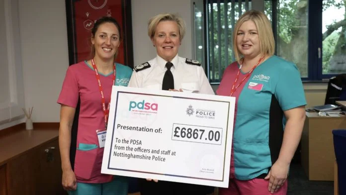 Gemma Thomas and Rebekah Blasdale, head nurses at the Nottingham PDSA, with Chief Constable Kate Meynell
