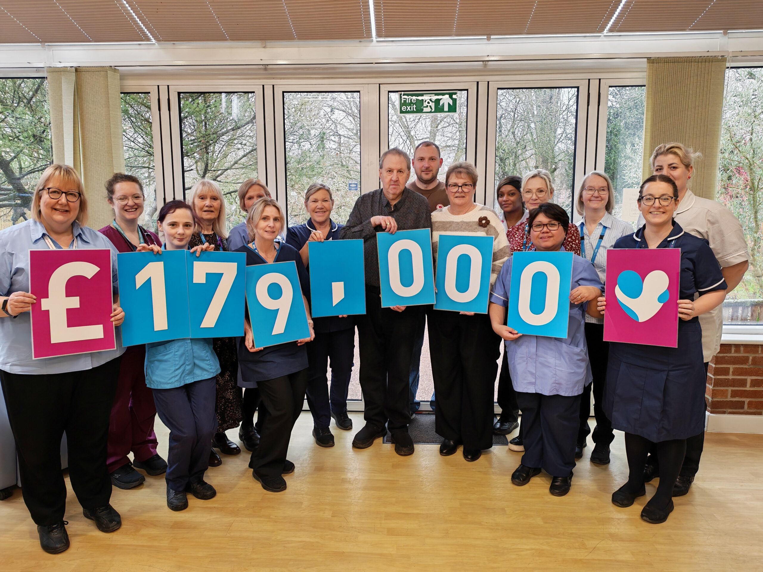 Nottingham family raises £300,000 with annual Christmas lights The Swift family with Hayward House staff scaled