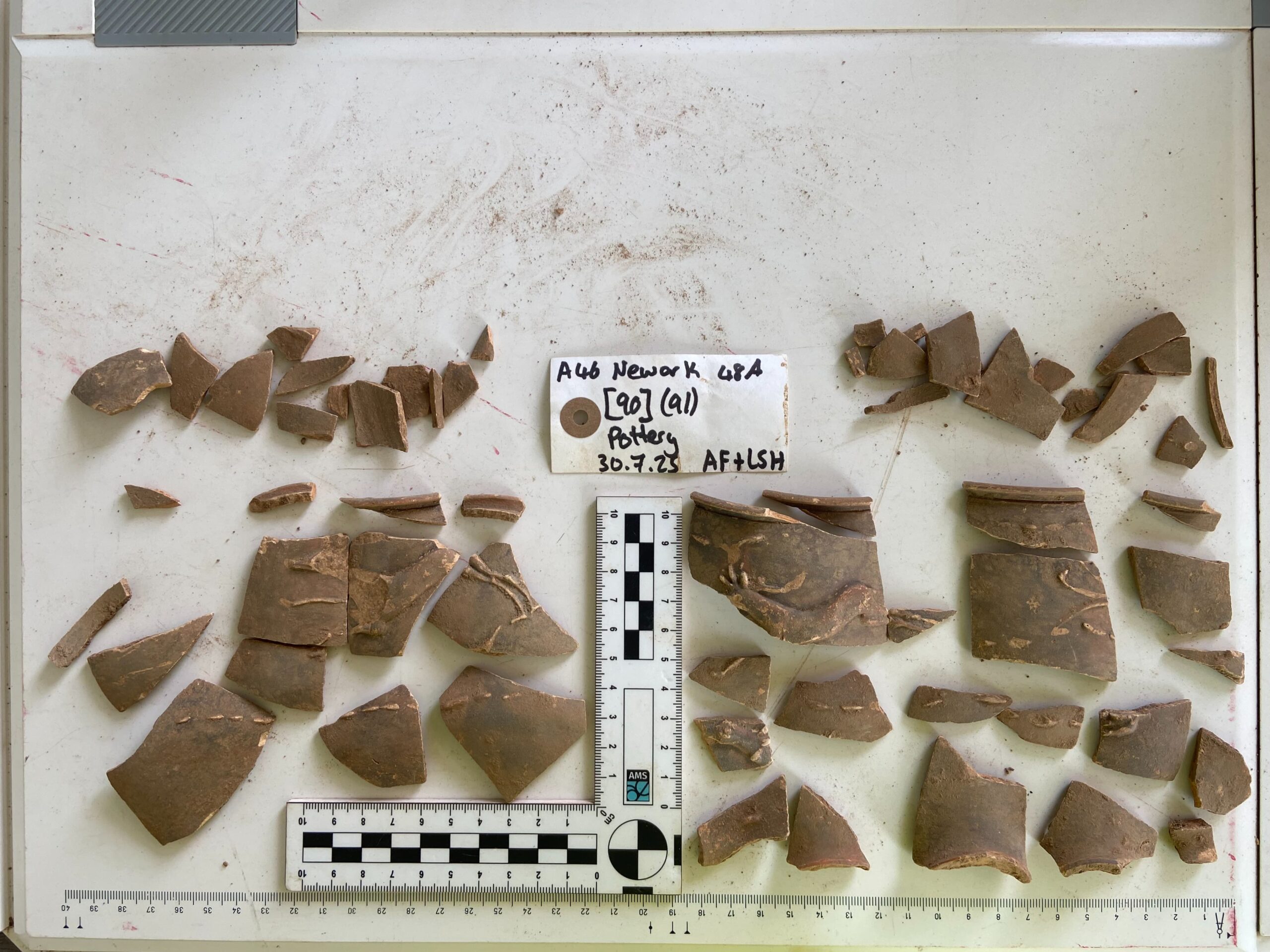 Sherds of a Roman terracota cup Credit National Highways AMS scaled